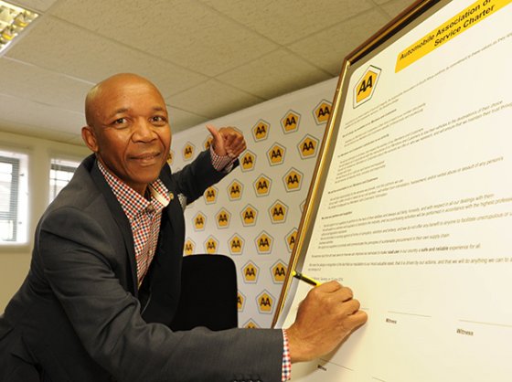 CEO Collins Khumalo signing the charter